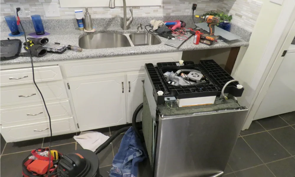 a kitchen with a stove, sink and refrigerator in it.